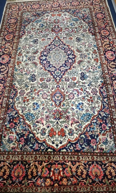 A Kashmir ivory ground rug 231 x 134cm